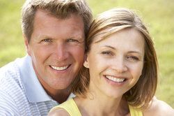 Youthful looking man and woman smiling